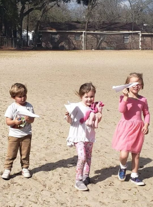 Girls learn about seeding at plant at the garden while they learn Spanish