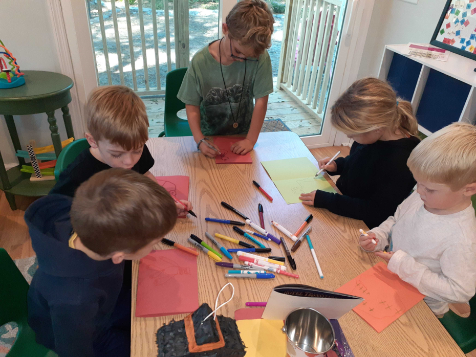 A teacher teaches Spanish to children at MIA Learning Center 